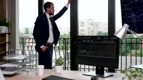 Free Video Stock thinking businessman stands by windows in office Live Wallpaper - Free Live Wallpaper