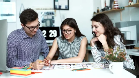 Free Video Stock three architects discussing a blueprint Live Wallpaper - Free Live Wallpaper