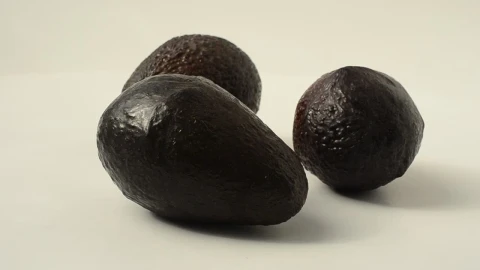 Free Video Stock three avocados rotating on a white background Live Wallpaper - Free Live Wallpaper