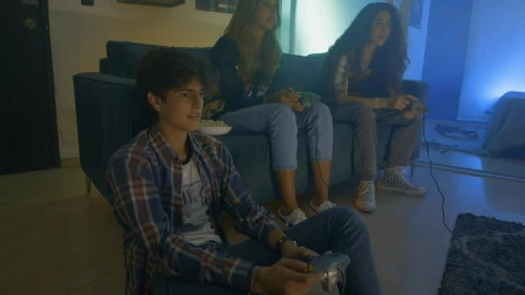 Free Video Stock three friends playing video games at night Live Wallpaper - Free Live Wallpaper