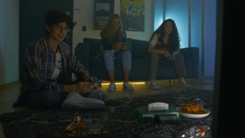 Free Video Stock three young friends playing video games Live Wallpaper - Free Live Wallpaper