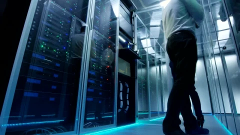 Free Video Stock time lapse of engineers working in a data center Live Wallpaper - Free Live Wallpaper