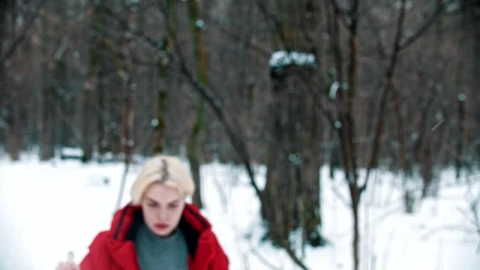 Free Video Stock tired female skier walks in the snow in the forest Live Wallpaper - Free Live Wallpaper