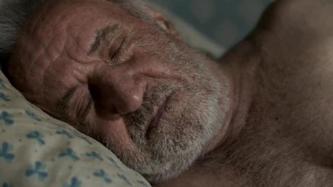 Free Video Stock tired old man wakes up in his bed Live Wallpaper - Free Live Wallpaper