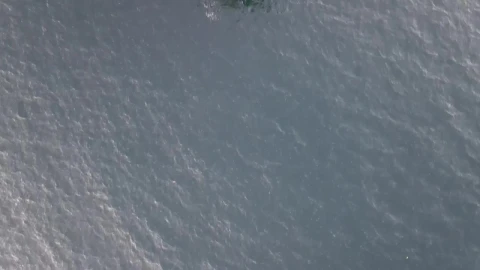 Free Video Stock top aerial shot of a cargo ship anchored Live Wallpaper - Free Live Wallpaper