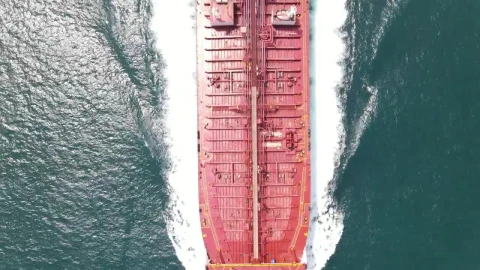 Free Video Stock top aerial shot of a cargo ship sailing in sea Live Wallpaper - Free Live Wallpaper