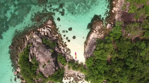 Free Video Stock top aerial shot of a small tropical island Live Wallpaper - Free Live Wallpaper