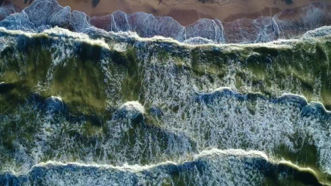 Free Video Stock top aerial view of the sea waves reaching a beach Live Wallpaper - Free Live Wallpaper