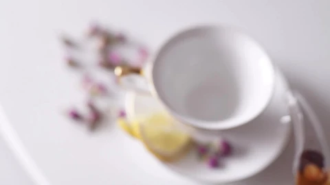 Free Video Stock top view of teapot pouring tea into china cup Live Wallpaper - Free Live Wallpaper