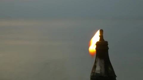 Free Video Stock torch burning in the evening Live Wallpaper - Free Live Wallpaper