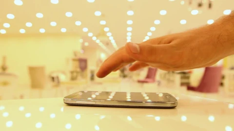 Free Video Stock touching a cell with one finger in a shop Live Wallpaper - Free Live Wallpaper