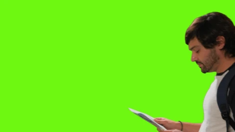 Free Video Stock tourist locating himself on a map on a chroma green Live Wallpaper - Free Live Wallpaper