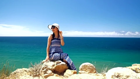Free Video Stock tourist posing on the seashore Live Wallpaper - Free Live Wallpaper