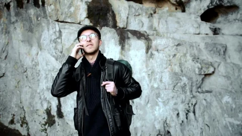 Free Video Stock tourist taking a call on a cave Live Wallpaper - Free Live Wallpaper
