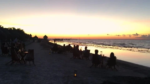 Free Video Stock tourists at a beach bar watching at sunset Live Wallpaper - Free Live Wallpaper