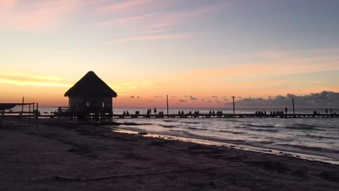 Free Video Stock tourists watching the sunset on a pier Live Wallpaper - Free Live Wallpaper