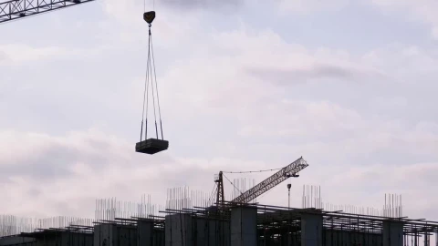 Free Video Stock tower crane with load on a construction site Live Wallpaper - Free Live Wallpaper