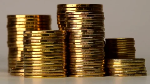 Free Video Stock towers of golden coins rotating on a gray background Live Wallpaper - Free Live Wallpaper