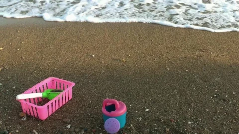 Free Video Stock toys on the sand by the sea Live Wallpaper - Free Live Wallpaper