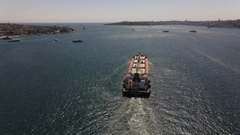 Free Video Stock tracking aerial shot of a cargo ship sailing Live Wallpaper - Free Live Wallpaper