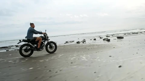 Free Video Stock tracking shot of a wanderlust riding a motorbike at the Live Wallpaper - Free Live Wallpaper