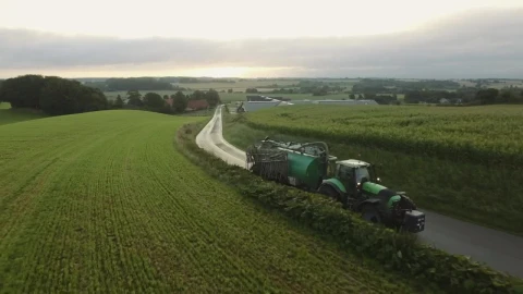Free Video Stock tractor driving on a country road Live Wallpaper - Free Live Wallpaper