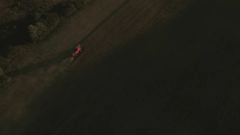 Free Video Stock tractor moving across a field Live Wallpaper - Free Live Wallpaper