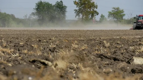Free Video Stock tractor passing over a dirt field Live Wallpaper - Free Live Wallpaper