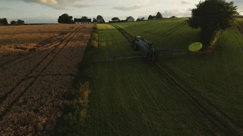 Free Video Stock tractor working near a farmhouse Live Wallpaper - Free Live Wallpaper