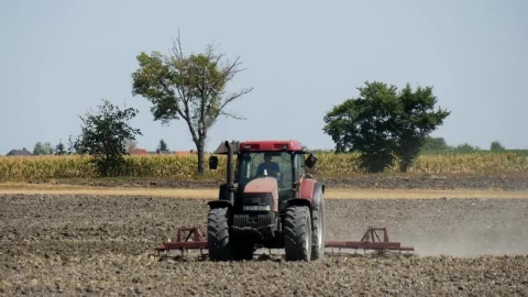 Free Video Stock tractor working on a field full shot Live Wallpaper - Free Live Wallpaper