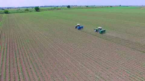 Free Video Stock tractors fertilizing agricultural fields Live Wallpaper - Free Live Wallpaper