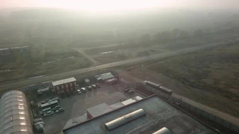 Free Video Stock traffic driving by a warehouse Live Wallpaper - Free Live Wallpaper