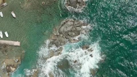 Free Stock Video Waves Breaking The Rocky Seashore Of A Tourist Port Live Wallpaper - Free Live Wallpaper