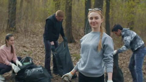 Free Stock Video Volunteer Showing The Trash She Recycles Live Wallpaper - Free Live Wallpaper
