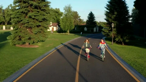 Free Stock Video Two Women Cycling Down A Road In The Suburbs Live Wallpaper - Free Live Wallpaper