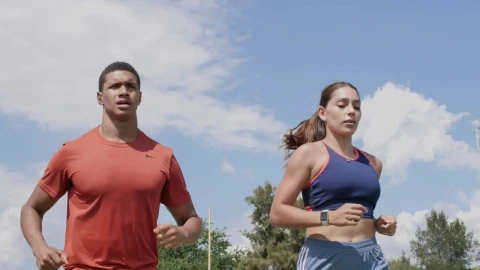 Free Stock Video Two People Running Outdoors On A Sunny Day Live Wallpaper - Free Live Wallpaper