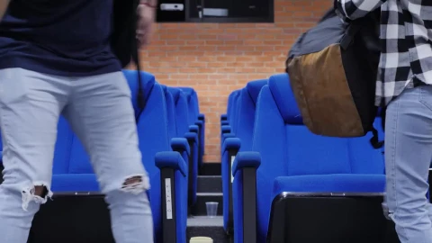 Free Stock Video Two Male And Female Students Sitting In An Auditorium Live Wallpaper - Free Live Wallpaper