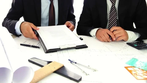 Free Stock Video Two Businessmen In Suits Reviewing Some Documents Live Wallpaper - Free Live Wallpaper