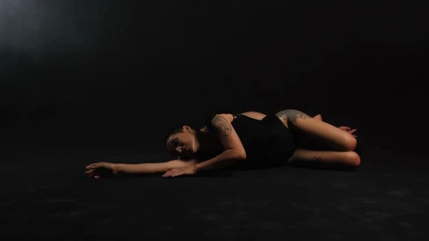 Free Stock Video Two Ballerinas Lying On The Floor On A Black Background Live Wallpaper - Free Live Wallpaper