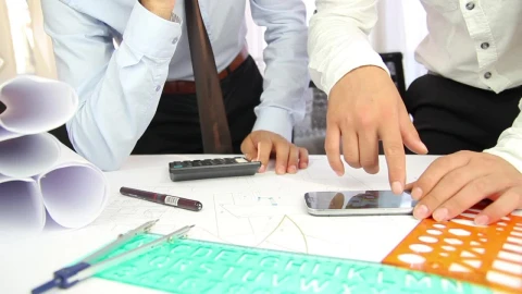 Free Stock Video Two Architects Discussing A Project On A Desk Live Wallpaper - Free Live Wallpaper