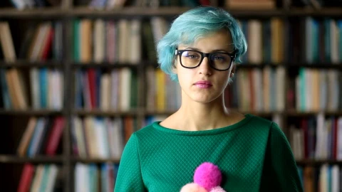 Free Stock Video Young Woman With Glasses In A Library Portrait Live Wallpaper - Free Live Wallpaper