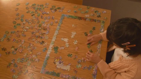 Free Stock Video Young Woman Putting Together A Puzzle Live Wallpaper - Free Live Wallpaper