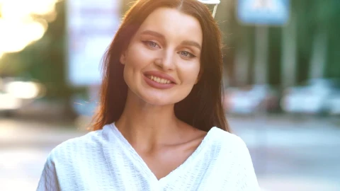 Free Stock Video Young Woman In The Street Smiling At The Camera Live Wallpaper - Free Live Wallpaper