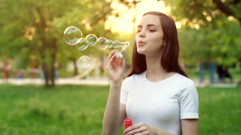 Free Stock Video Young Woman In A Park Blowing Soap Bubbles Live Wallpaper - Free Live Wallpaper