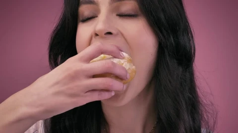 Free Stock Video Young Woman Giving A Big Bite A Donut Live Wallpaper - Free Live Wallpaper