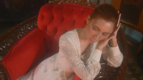 Free Stock Video Young Woman From An Old Era Sitting On A Sofa Live Wallpaper - Free Live Wallpaper