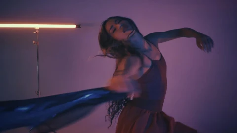 Free Stock Video Young Woman Dancing And Spinning In A Dark Studio Live Wallpaper - Free Live Wallpaper