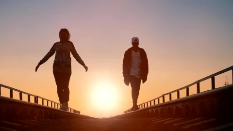 Free Stock Video Young Urban Couple Walking On The Train Tracks Live Wallpaper - Free Live Wallpaper