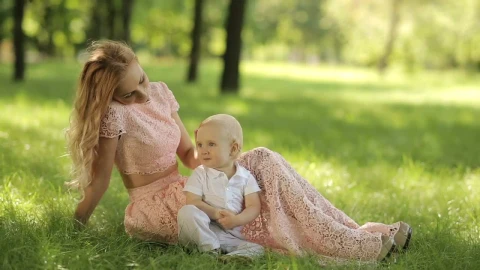 Free Stock Video Young Mother Caresses Her Son In The Park Live Wallpaper - Free Live Wallpaper