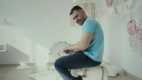 Free Stock Video Young Man Riding A Toy Horse Live Wallpaper - Free Live Wallpaper